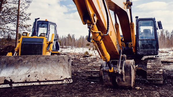 bulldozer och grävmaskin för dränering
