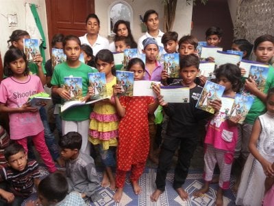 A couple of kids in KKC F-city in Pakistan received kid-bibels written in Urdu